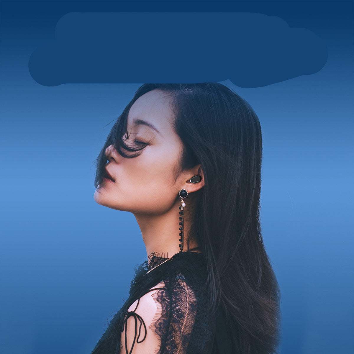 Woman wearing black Mini Bluetooth Wireless Headphones 5.0 Double Earbuds against blue background